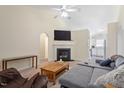 Comfortable living room featuring a fireplace, vaulted ceilings, and an open layout ideal for entertaining at 5104 Parkerwood Dr, Knightdale, NC 27545