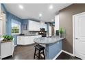 Bright kitchen featuring white cabinetry, granite counters and stainless steel appliances at 605 Smallwood Dr, Durham, NC 27703