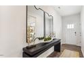 Bright entryway with a console table, decorative mirrors, and stylish decor at 75 Fair Child Rd, Spring Lake, NC 28390