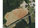 Aerial view of a large lot, marked with a red line, ready for development on Savage Rd at 8500 Savage Rd, Spring Hope, NC 27882