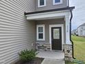 Inviting front porch featuring stone accents and a stylish entrance door at 112 Wilbur Lake Dr, Fuquay Varina, NC 27526
