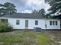 Backyard view featuring a well-maintained lawn and the back of the house at 1336 Hill Street St, Rocky Mount, NC 27801