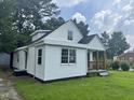 Quaint single-Gathering home showcasing a well-manicured lawn and classic siding at 1336 Hill Street St, Rocky Mount, NC 27801
