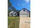 Charming one-story home with attached garage and driveway at 1414 Sagamore Dr, Louisburg, NC 27549