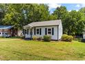 Charming single-story home with well-maintained lawn and curb appeal at 1543 Wickham St, Burlington, NC 27215