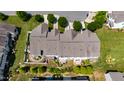 An aerial shot displays the roof and backyards of the townhomes, complete with patios and lush greenery at 16 Daly Ct, Durham, NC 27705