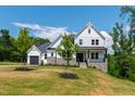 Beautiful exterior of a two-story home with stone accents and a well-maintained lawn at 164 E Spring Showers Trail Trl, Angier, NC 27501