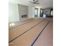 Spacious living room with modern fireplace and abundant natural light filtering through large windows at 213 Maye St, Dunn, NC 28334