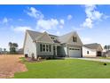 Beautiful single-Gathering home with a well-manicured lawn and an attached garage and private driveway at 222 Cherrybirch Ln, Zebulon, NC 27597