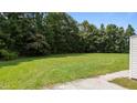 Large backyard featuring lush green grass, perfect for outdoor activities and relaxation at 236 Katie Dr, Rocky Mount, NC 27803