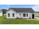 Back exterior view of a well-maintained house with gray roof and vinyl siding at 236 Katie Dr, Rocky Mount, NC 27803