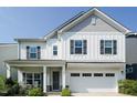 Charming two-story home with white siding, a covered porch, and a two-car garage at 365 Jorpaul Dr, Wake Forest, NC 27587