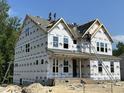 New two-story home featuring craftsman style and large windows, still under construction at 386 Rising Star Dr, Clayton, NC 27520