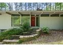 Close up of home's front exterior with brick steps leading to the front door with a decorative wreath at 4501 Zebulon Rd, Zebulon, NC 27597