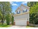 Charming two-story home with gray siding, brick accents, and a well-manicured front yard at 5301 Denmead Way, Raleigh, NC 27613