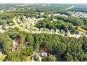 Spacious community surrounded by lush greenery and a mix of traditional-style homes at 5721 Meadow Run, Knightdale, NC 27545