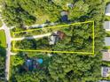 Aerial view of property with estimate of the borders, surrounded by lush greenery at 5721 Meadow Run, Knightdale, NC 27545