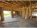 Bright interior framing showing the room's window placement and open layout concept at 76 Tuskeegee Dr, Smithfield, NC 27577