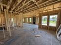 Spacious interior framing with ample natural light showcasing the room's potential and design elements at 76 Tuskeegee Dr, Smithfield, NC 27577