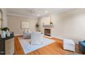 Neutral living room with hardwood floors, fireplace, and elegant decor at 7713 Summercrest Dr, Apex, NC 27539