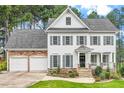 Charming two-story home with a manicured lawn and a two-car garage at 1120 Colonial Club Rd, Wake Forest, NC 27587