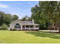 Beautiful single-story home boasting a well-kept lawn, front porch, and inviting curb appeal at 117 S Woodstone Dr, Archer Lodge, NC 27527