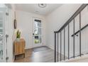 Bright foyer with stairs and natural light entering through the front door at 1172 Cottonsprings Dr, Wendell, NC 27591