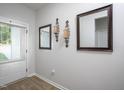 Inviting foyer with decorative mirrors and sconces, leading into the home at 133 Black Cloud Dr, Louisburg, NC 27549