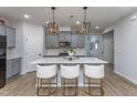 Modern kitchen with sleek countertops, stainless steel appliances, and stylish pendant lighting at 133 Black Cloud Dr, Louisburg, NC 27549