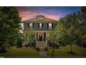 Charming two-story home with inviting front porch and stairway leading to the front door under a beautiful sunset at 149 N Serenity Hill Cir, Chapel Hill, NC 27516