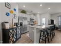 Modern kitchen with stainless steel appliances, granite countertops, and a breakfast bar at 1891 Frost Dr, Haw River, NC 27258