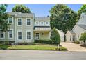 Charming two-story home featuring a well-manicured front yard, attached garage, and classic architectural details at 2000 Silky Dogwood Trail Trl, Apex, NC 27502