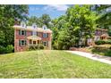 Classic brick home with dormers, a large front yard and private driveway at 212 Heidinger Dr, Cary, NC 27511