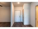 Inviting entryway featuring wood floors, a solid white front door and a coat closet at 2323 Gathering Sq Ct, Fuquay Varina, NC 27526
