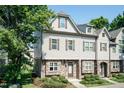Charming two-story townhome featuring stone accents, neutral siding, and well-maintained landscaping at 2808 Carter Finley Pl, Raleigh, NC 27606