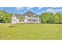Charming two-story home with landscaped yard and an attached garage at 407 Kadir Womble Dr, New Hill, NC 27562