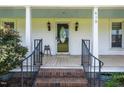 Inviting front porch with brick steps, decorative glass door, and a 'Welcome' sign at 419 Mabry Rd, Angier, NC 27501