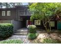 Charming townhome with a red door, balcony, and mature trees at 4403 Sunburst Ct, Raleigh, NC 27613