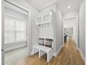 Bright foyer with coat rack, bench and view of the natural light coming through a window at 733 Daniel Ridge Rd, Wendell, NC 27591