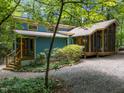 A charming home with a screened-in porch and a gravel driveway at 9709 Greenfield Rd, Chapel Hill, NC 27516