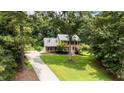 Beautiful two-story home with brick facade and green lawn, surrounded by mature trees at 10721 Marabou Ct, Raleigh, NC 27614
