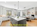 Open concept kitchen featuring a large island, stainless steel appliances, and hardwood flooring at 110 Broadleaf Ln, Louisburg, NC 27549