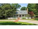 Charming home with white picket fence and brick driveway at 12201 Lockhart Ln, Raleigh, NC 27614