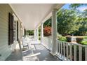 Relaxing front porch with rocking chairs at 12201 Lockhart Ln, Raleigh, NC 27614