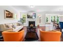 Bright living room with a cozy fireplace, modern furniture, and hardwood floors at 1321 White Spruce Dr, Willow Springs, NC 27592
