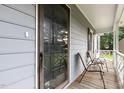 Inviting covered front porch with rocking chairs, perfect for enjoying the outdoors at 204 Valley Ct, Selma, NC 27576