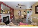 Inviting living room featuring a cozy fireplace, stylish furnishings, and bright, airy ambiance at 205 Cedar Dr, Zebulon, NC 27597
