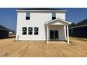 New construction home with a backyard patio area, providing a blank canvas for outdoor living at 236 Norman Ave, Lillington, NC 27546