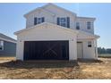 Two-story home showcasing unfinished garage, new construction, and great potential for personalization at 236 Norman Ave, Lillington, NC 27546
