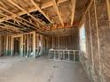 Unfinished home interior with exposed framing, offering a glimpse into the construction progress at 236 Norman Ave, Lillington, NC 27546